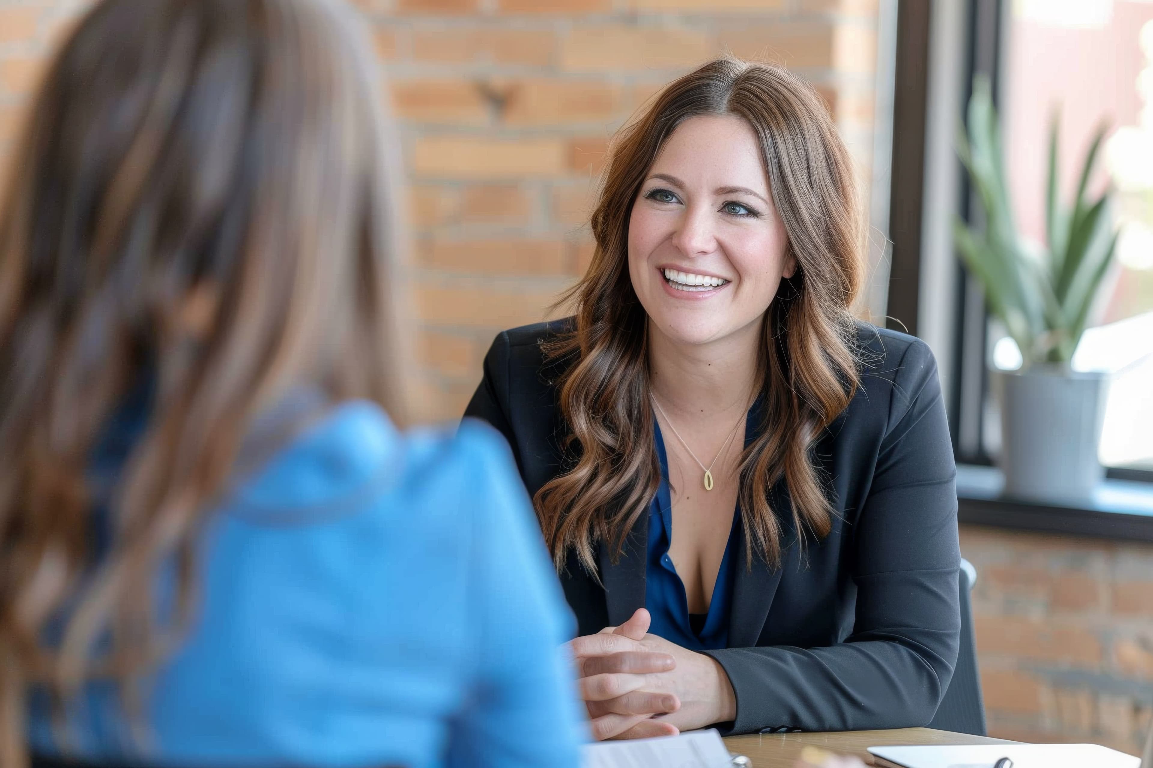 Two colleagues in a business meeting, representing New Nexus Group's Manage Retail services